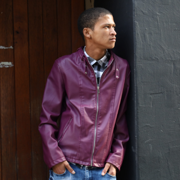 young boy sitting in barbers chair