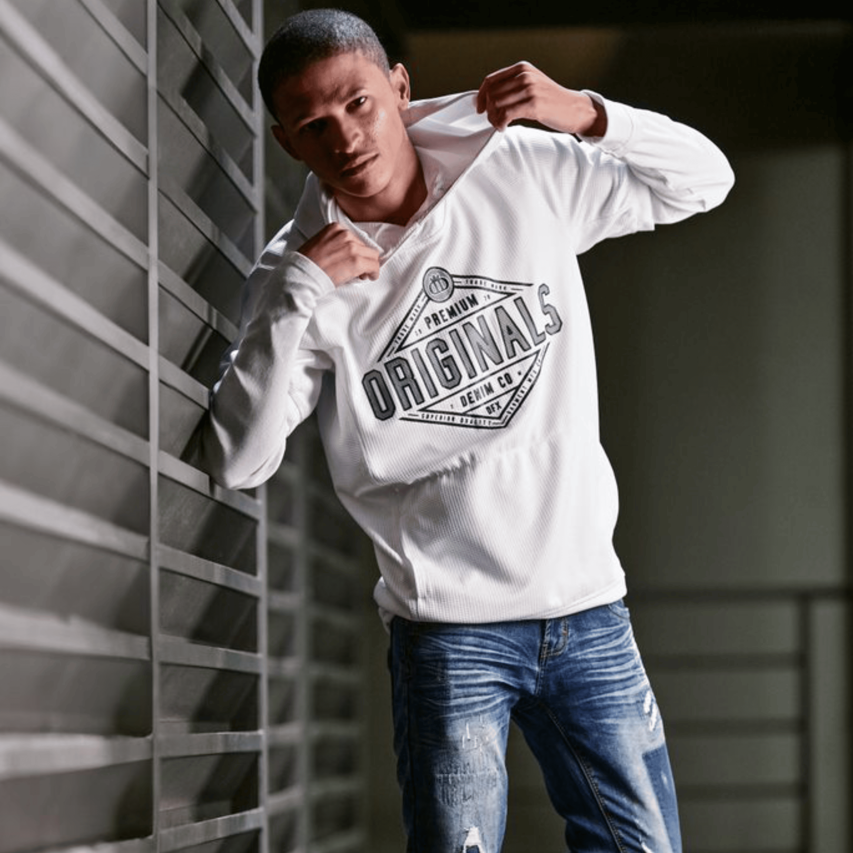 young man side profile having beard trimmed with scissors